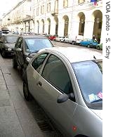 Cars are lining the edge of every street