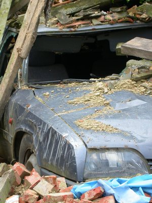 Car Under Collapsed Building