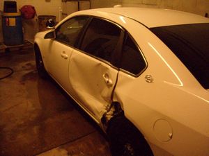Dented Sheriff's Department Car