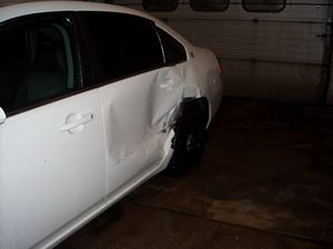 Dented Sheriff's Department Car