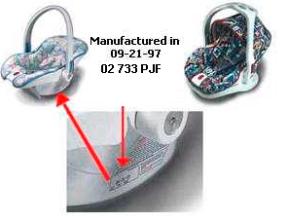 The model number and manufacture date are located on the instruction and warning label on the side of the car seat/carrier.