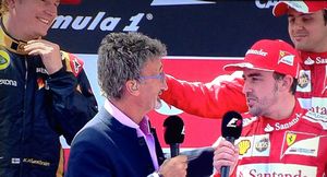 Felipe Massa pretends to pull Eddie Jordan's wig off
