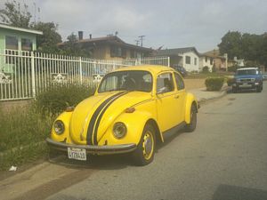yellow Volkswagen Beetle