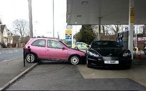 Aston Martin DBS trashed by pink Corsa