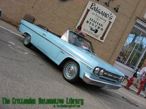 Bill Crittenden taking a picture of a 1965 Rambler Classic 770