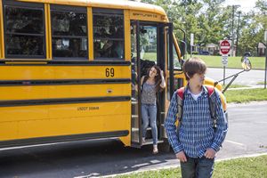 Teens Getting Off School Bus