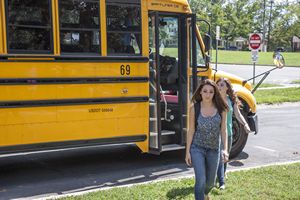 Teens Getting Off School Bus