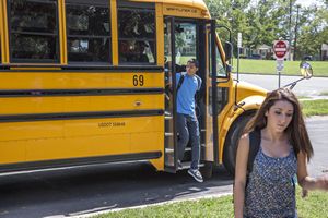 Teens Getting Off School Bus