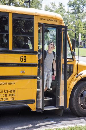 Teens Getting Off School Bus