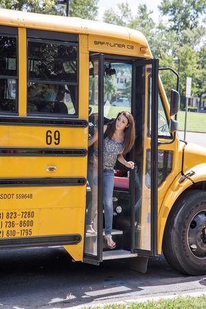 Teens Getting Off School Bus