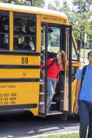 Teens Getting Off School Bus