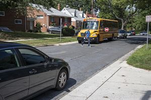 Crossing Street in front of School Bus
