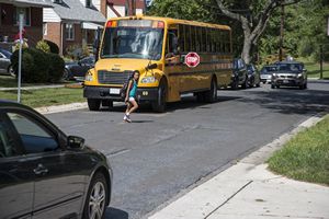 Crossing Street in front of School Bus
