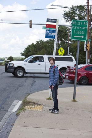 Student at Bus Stop