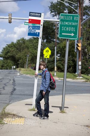 Student at Bus Stop