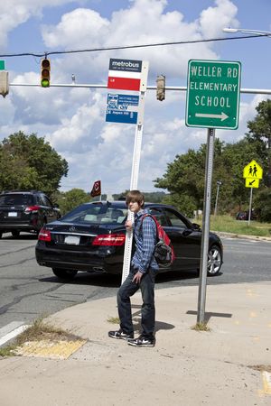 Student at Bus Stop