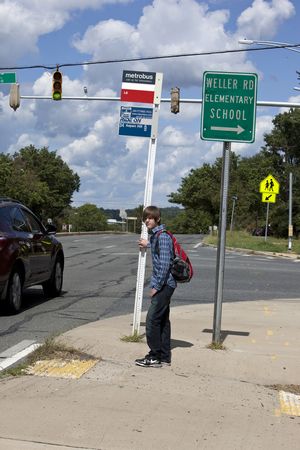 Student at Bus Stop